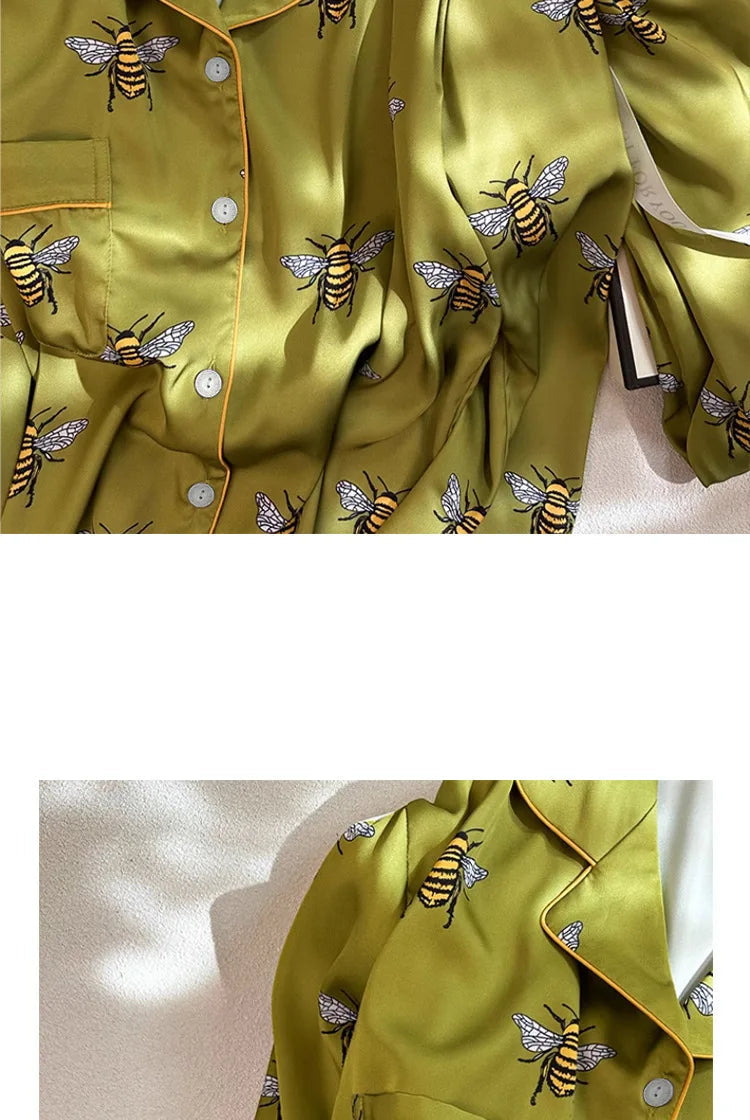 Green shirt with bee embroidery on a light background, labeled 'Autumn'.