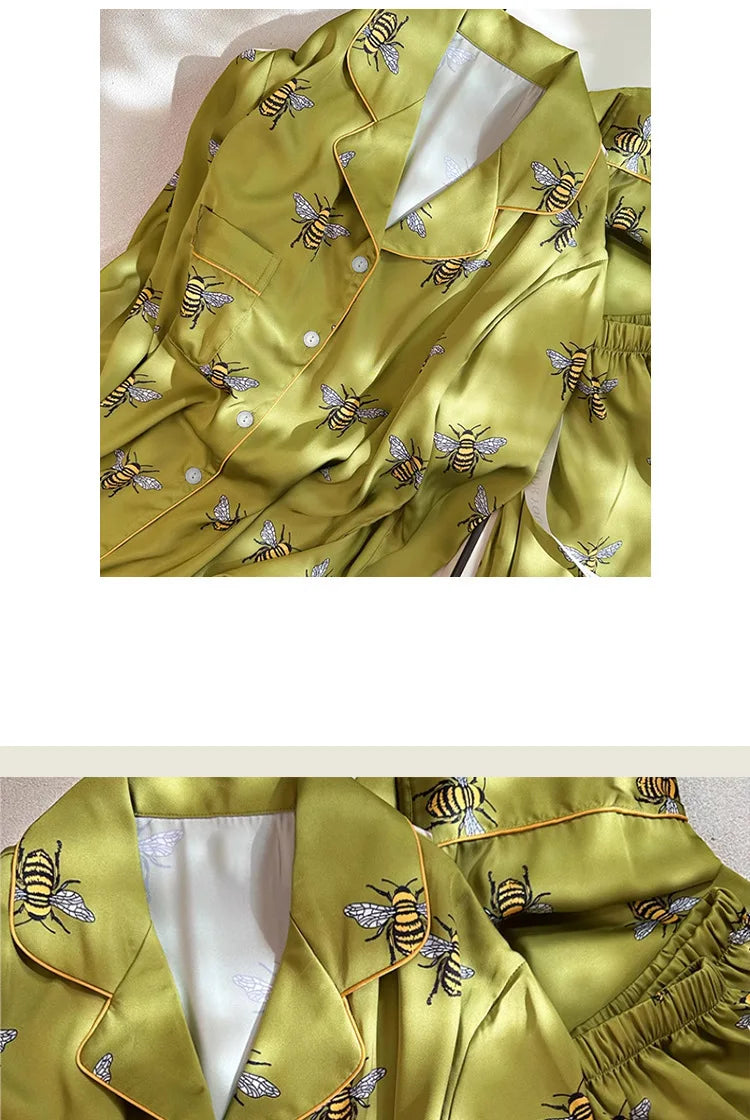 Yellow satin shirt with bee pattern on a white background