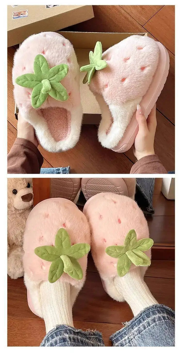 Pink slippers with green leaves held by a hand and worn on feet.