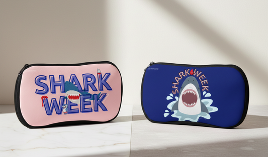 Two pouches with 'Shark Week' design on a light background